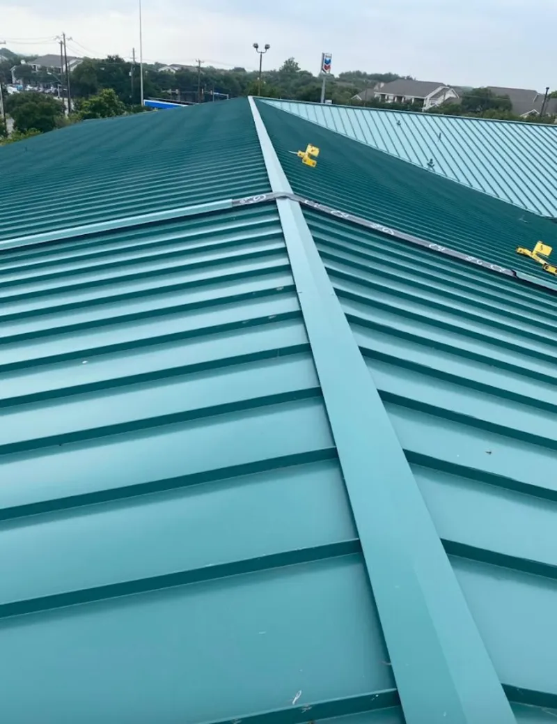 Green commercial metal roof ridge and valley for Metal Roof Repair in Appleton